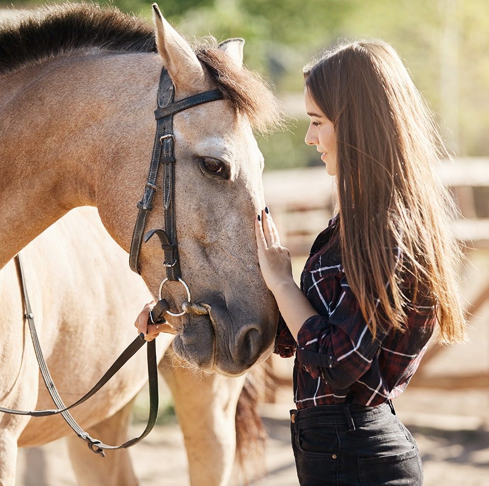 Girl bonding with her horse
